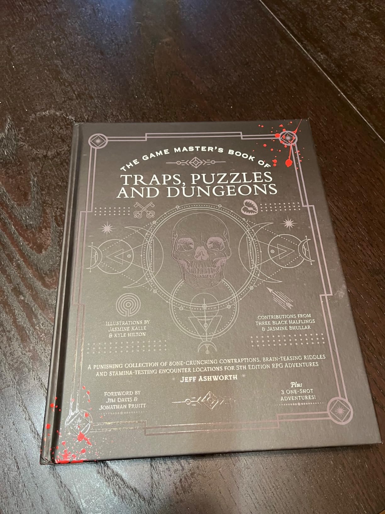 The Game Master's Book of Traps, Puzzles and Dungeons: A punishing collection of bone-crunching contraptions, brain-teasing riddles and ... RPG adventures (The Game Master Series) customer photo 2