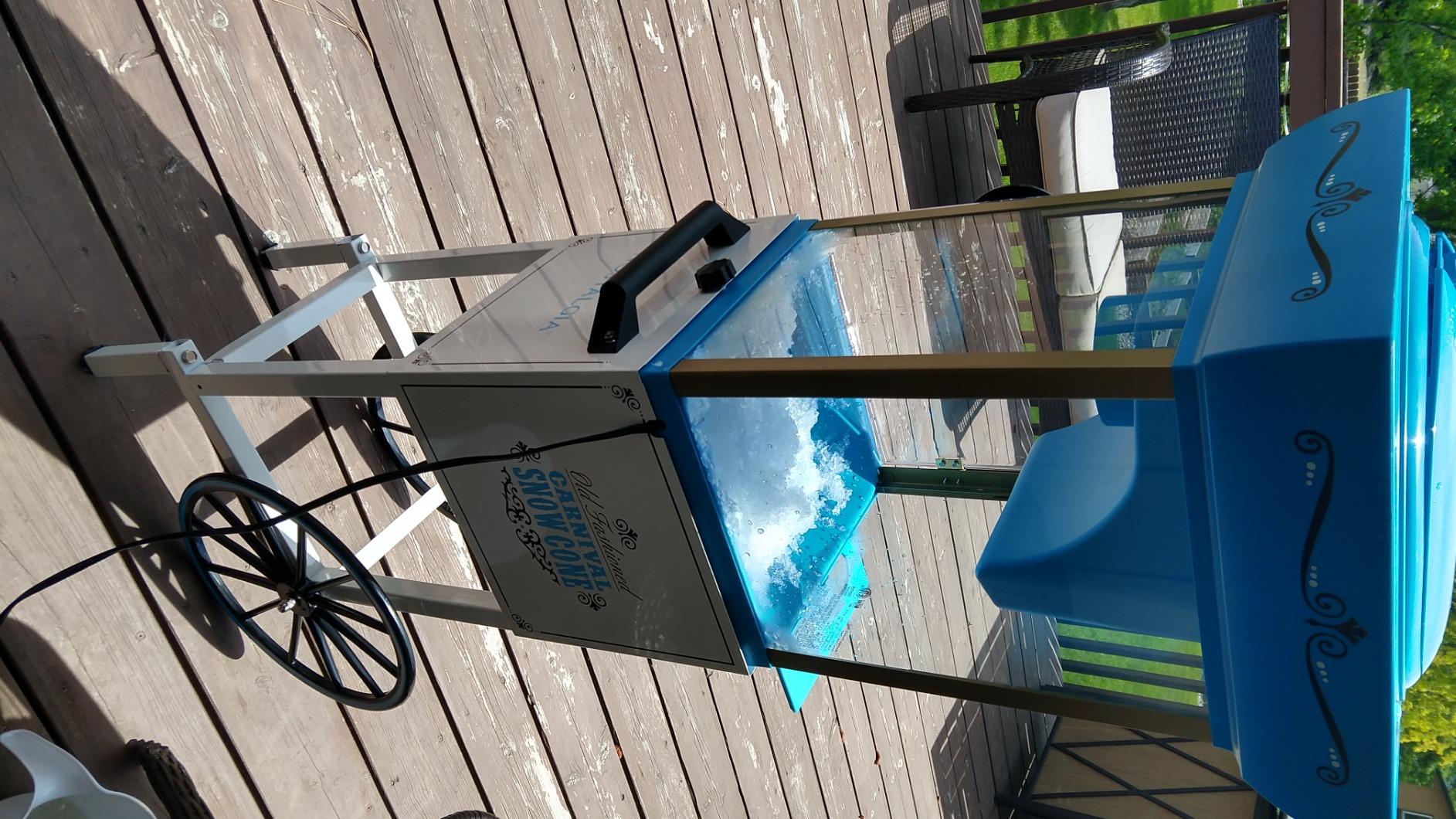 Nostalgia Snow Cone Shaved Ice Machine - Retro Cart Slushie Machine Makes 48 Icy Treats - Includes Metal Scoop, Storage Compartment, Wheels for Easy Mobility - White, Blue customer photo 1