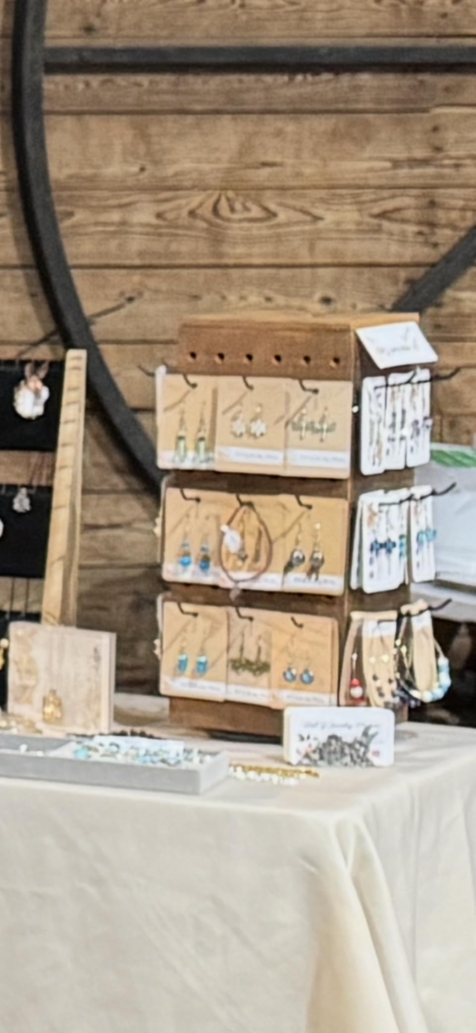 MOOCA Rotating Wooden Jewelry Display with 48 Hooks, Brown | Four-sided rotating wood pegboard with 48 removable hooks and lidded inner storage displays jewelry and accessories. customer photo 1